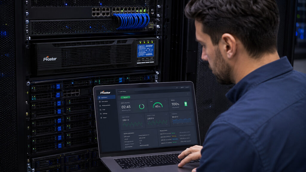 IT engineer monitoring rackmount UPS status through remote management dashboard